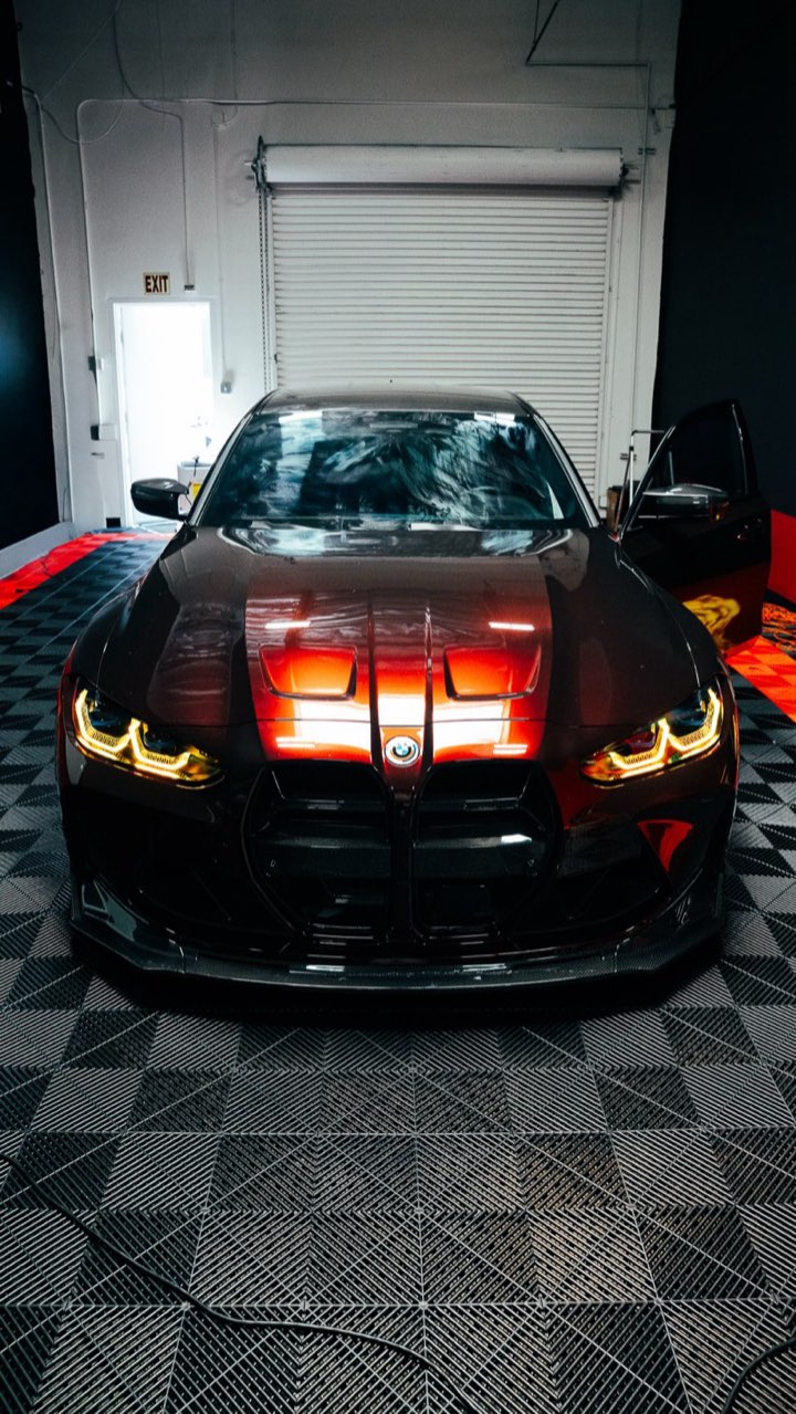 BMW in a full color change wrap outside the Most Wanted studio