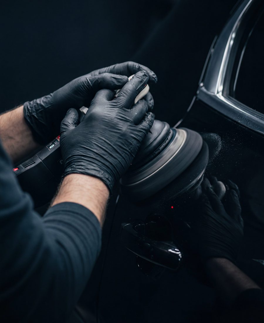 Machine polishing a panel during paint correction